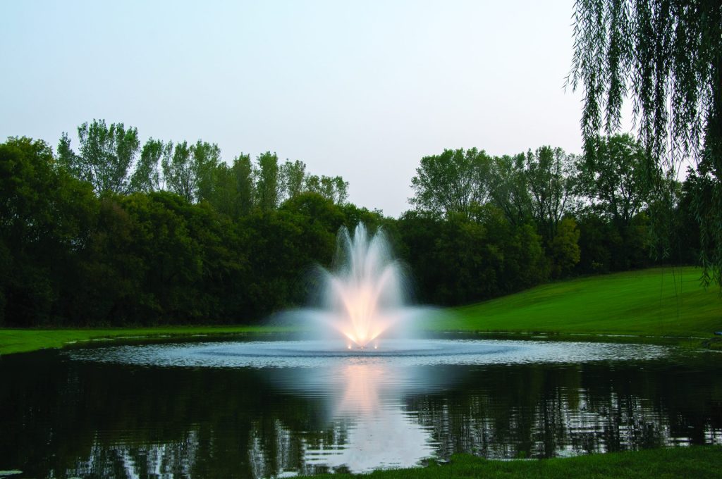 Example of a Kasco JF decorative fountain with illuminated spray patterns designed primarily for visual appeal in ponds and landscape water features.