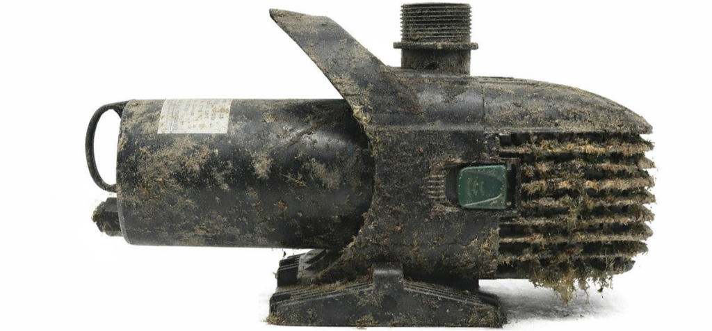 Dirty pond fountain pump with debris buildup on intake screen and housing