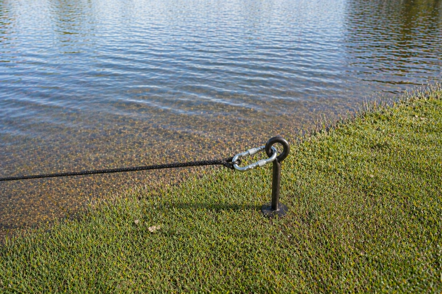 Pond fountain anchor line secured near shoreline